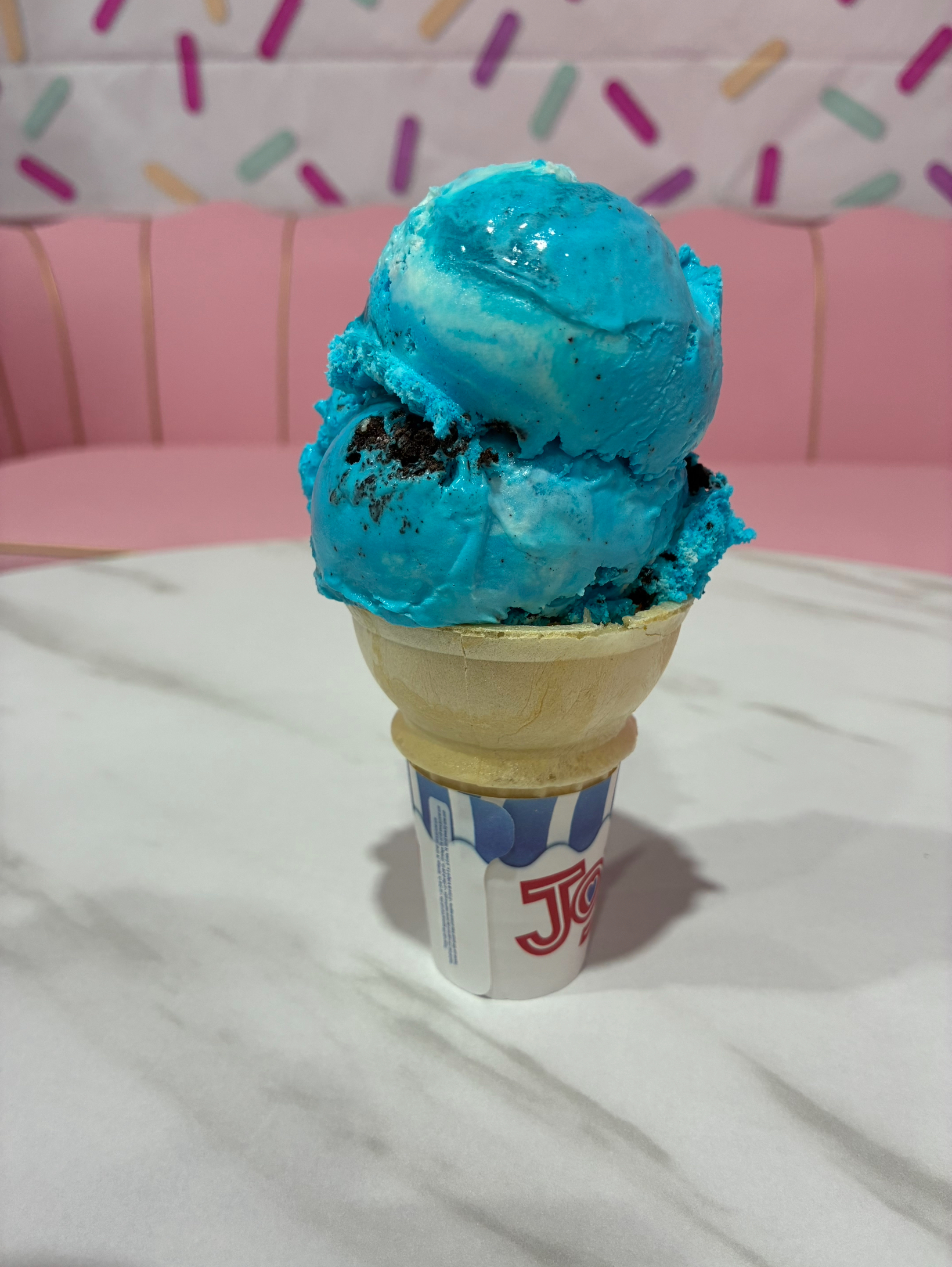 Double scoop blue cookie monster ice cream cone at Sweet Swirls